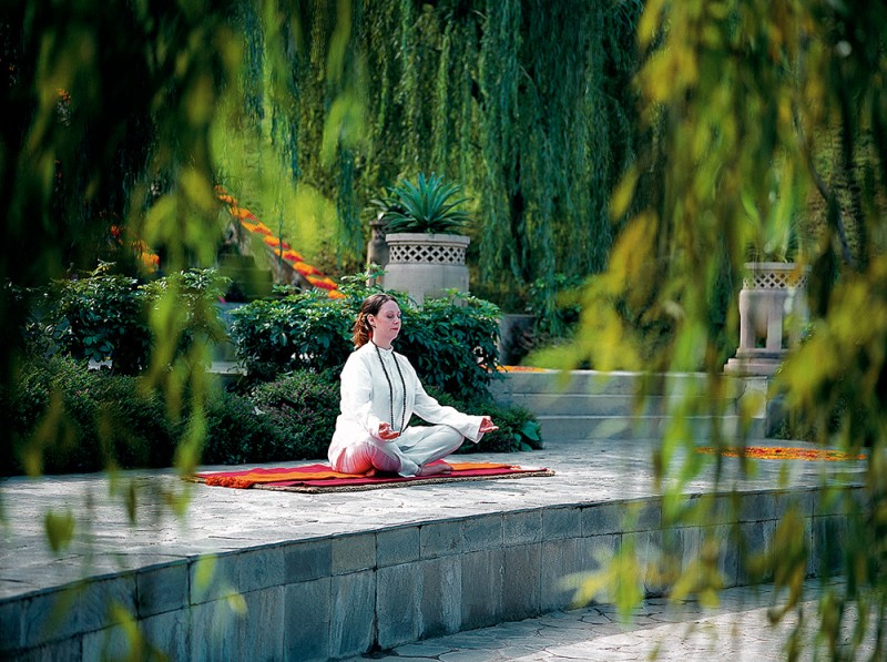 Woman Meditiating at Ananda Destination Spa, India