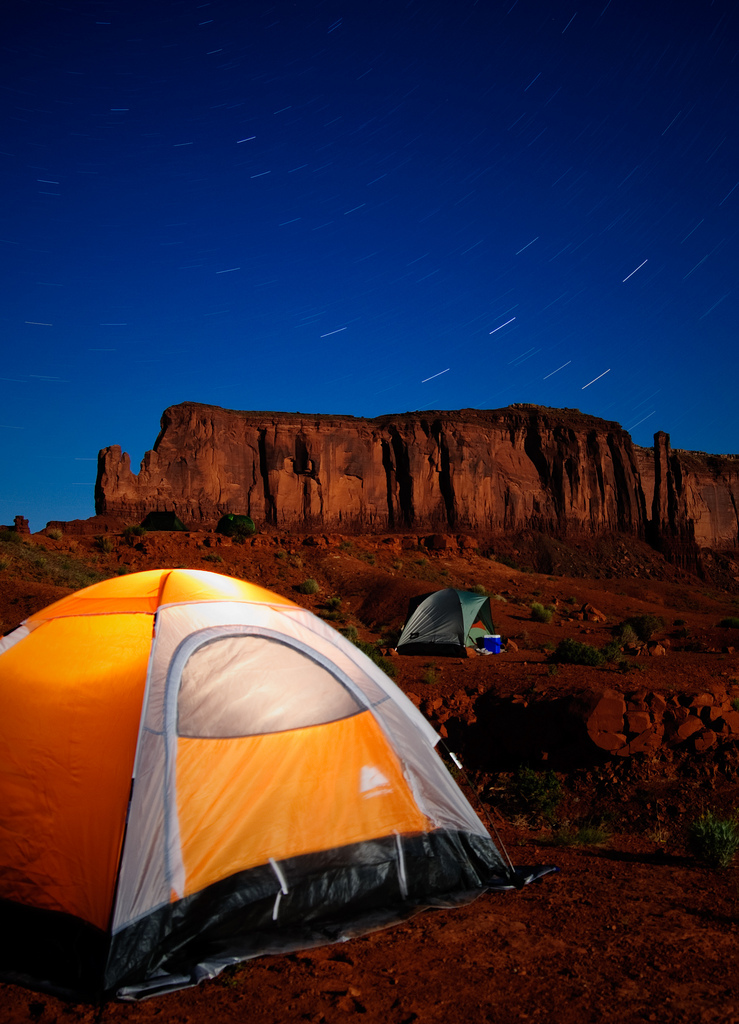 Two tents pitched under the stars in Monument Valley, Utah