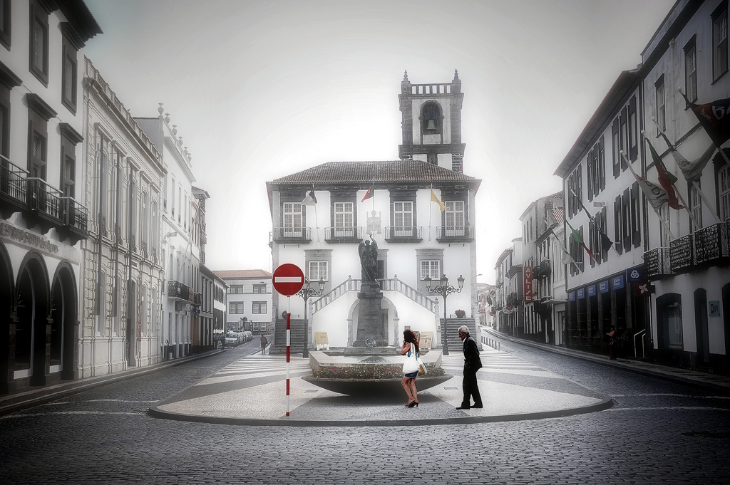 Man and woman alone on street in Sao Miguel, Azores, Portugal
