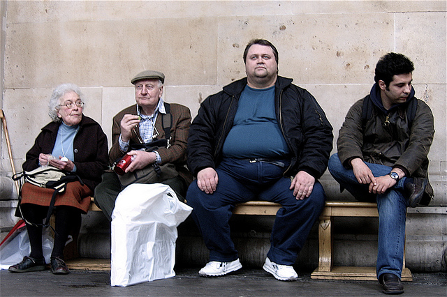 Four very different people on a bench in Camden, London