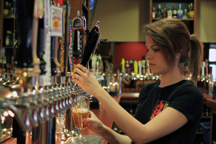 Girl pouring tap beer at Harrisburg's Federal Taphouse