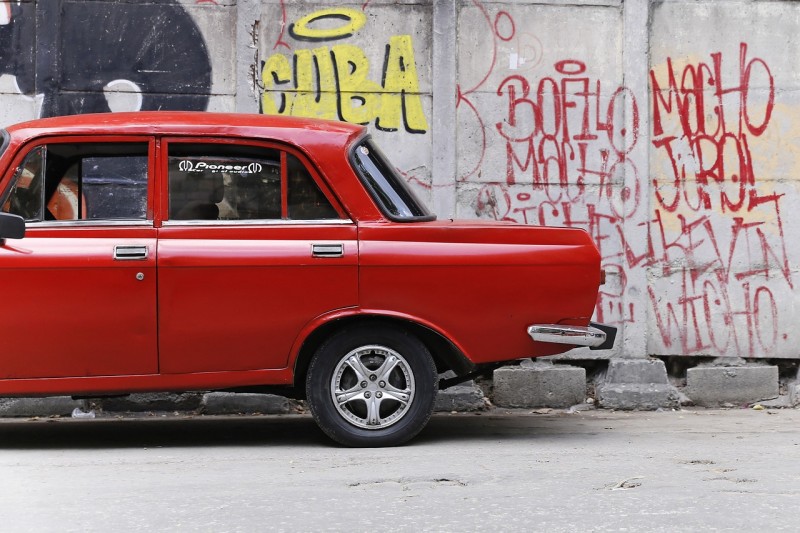 Graffiti and a Red Car in Cuba