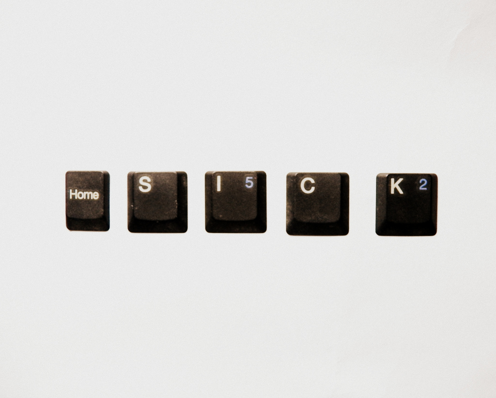 "Homesick" (spelled out in keyboard keys on white)