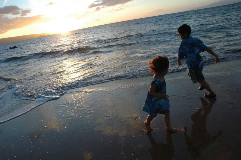 Kids Playing at Sunset at Makena Beach, Maui, Hawaii