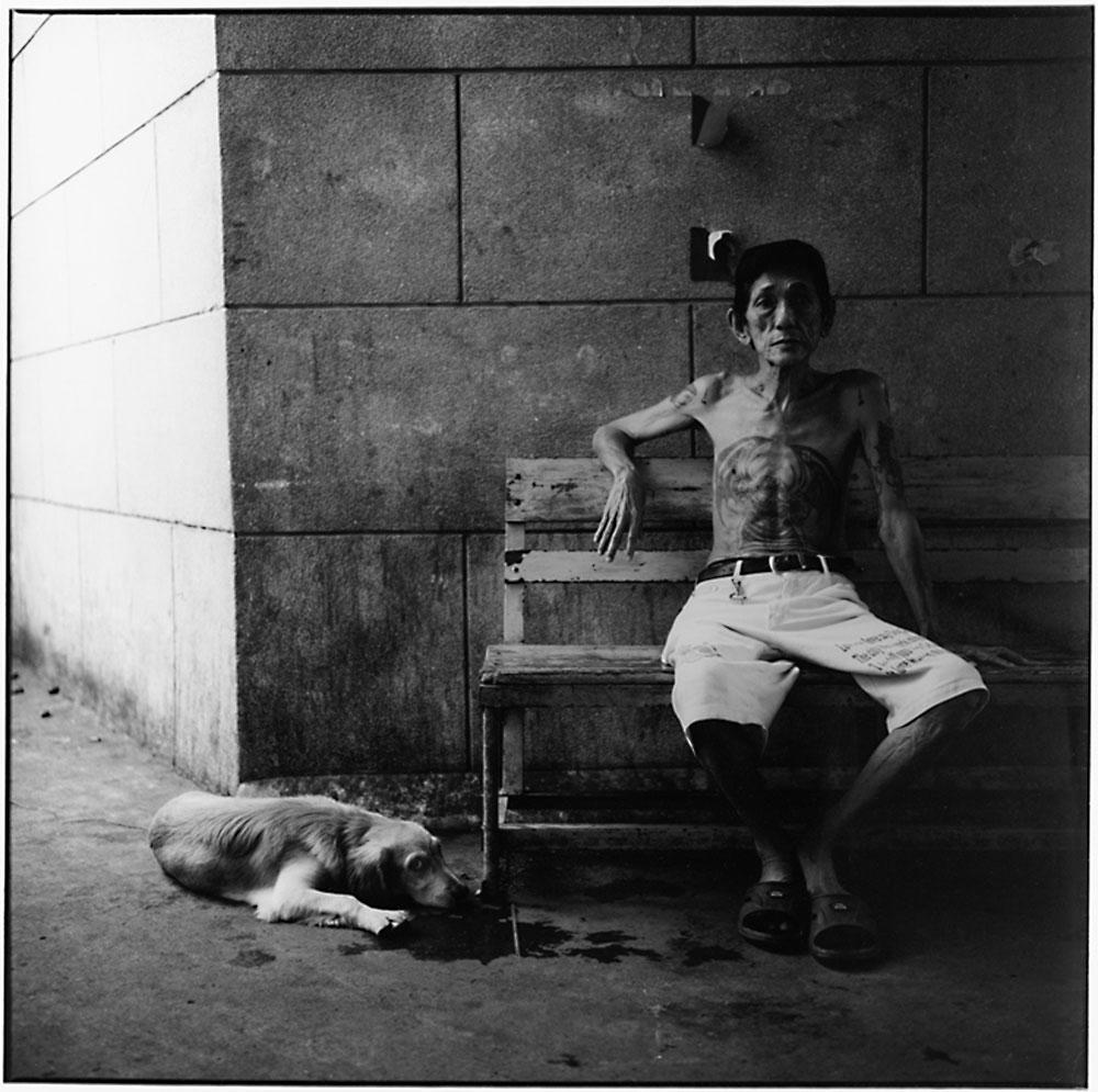 Man with dog in Thailand