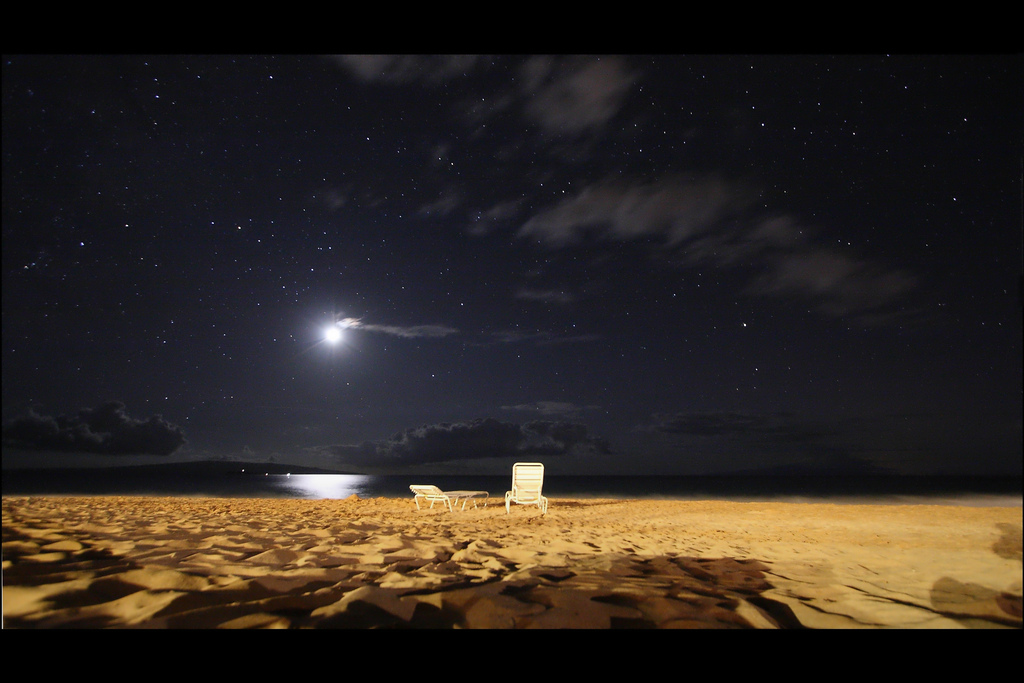 Two beach chairs in the moonlight on Maui, Hawaii