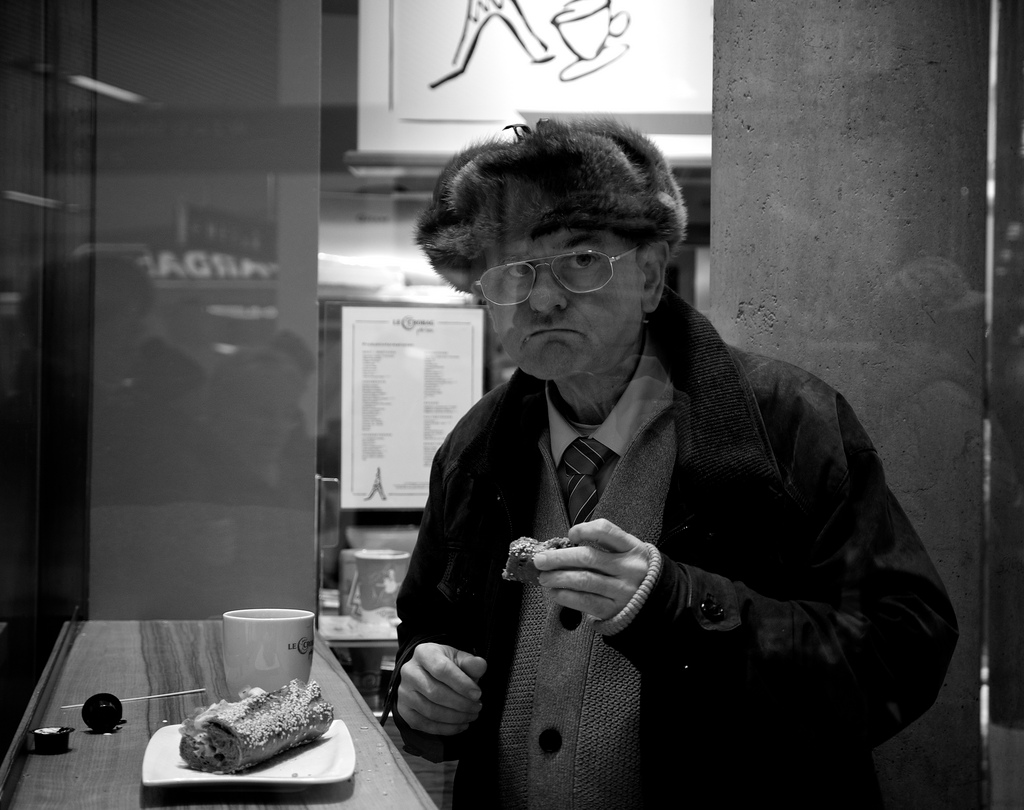 Old man snacking in Salzburg, Austria
