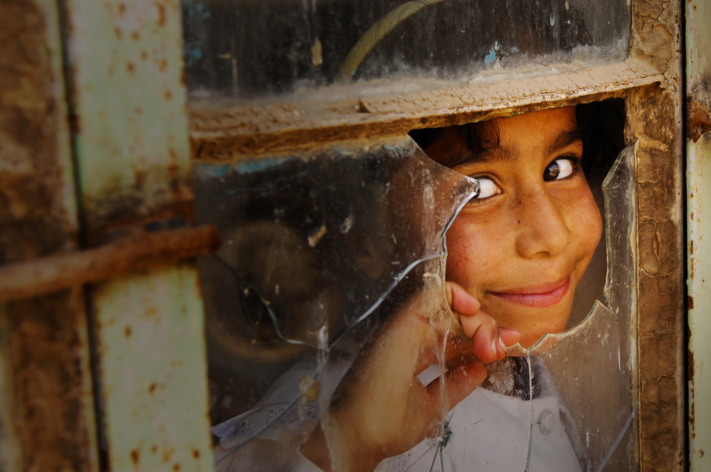 Girl Peeking Out Classroom Window, Iraq