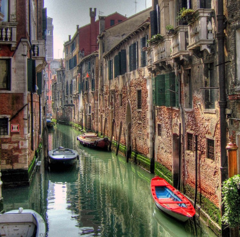 Lone Red Boat in Venice, Italy