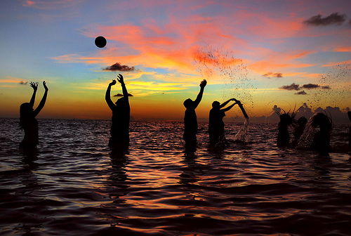 Silhouettes playing at the beach, Maldives
