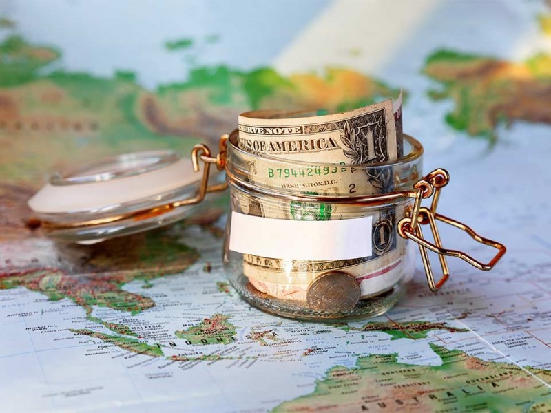 Small Money Jar on a World Map