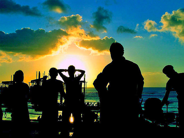 Silhouette of group watching sunset in Bali, Indonesia