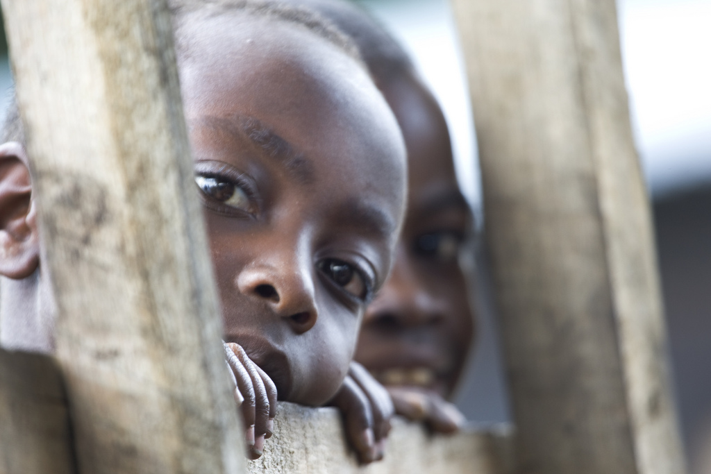 Two curious, eavesdropping boys in Congo